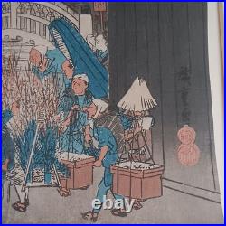 Japanese Woodblock print by Utagawa Hiroshige, titled Nihonbashi Morning Scene