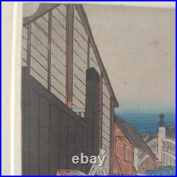 Japanese Woodblock print by Utagawa Hiroshige, titled Nihonbashi Morning Scene