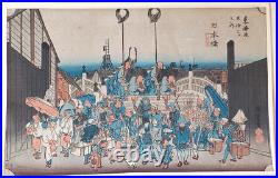 Japanese Woodblock print by Utagawa Hiroshige, titled Nihonbashi Morning Scene