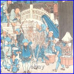 Japanese Woodblock print by Utagawa Hiroshige, titled Nihonbashi Morning Scene