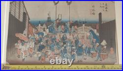 Japanese Woodblock print by Utagawa Hiroshige, titled Nihonbashi Morning Scene